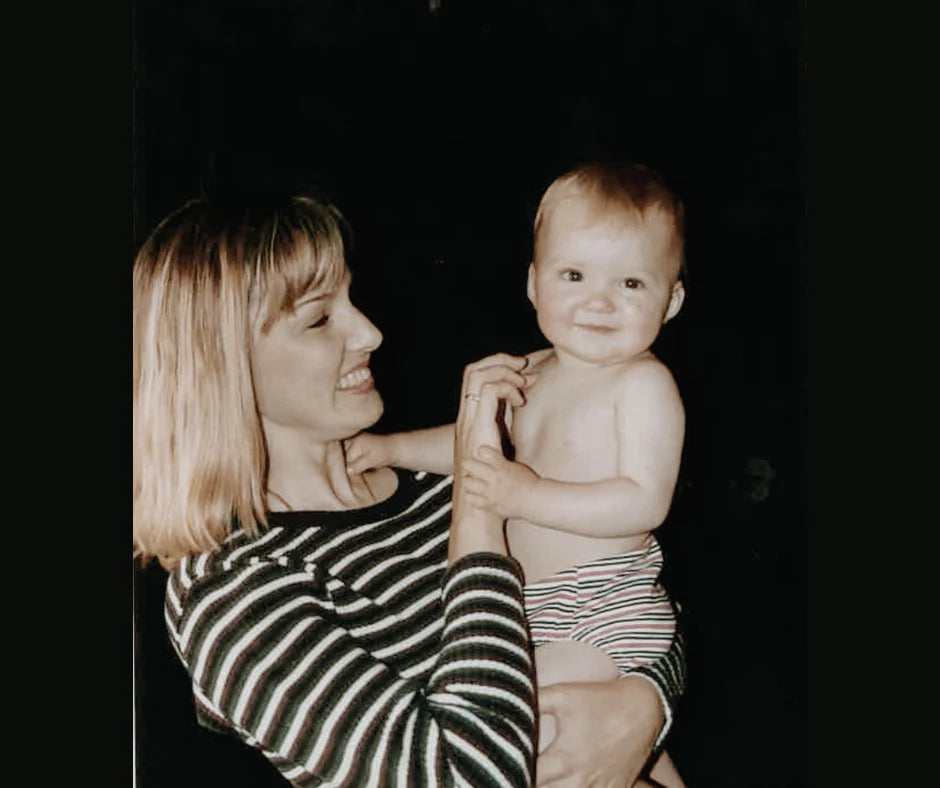 About Us Mum Holding Baby