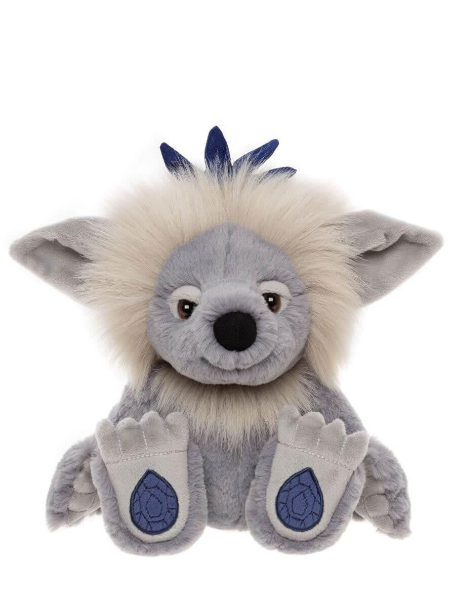Plush troll toy with gray and white fur on a white background