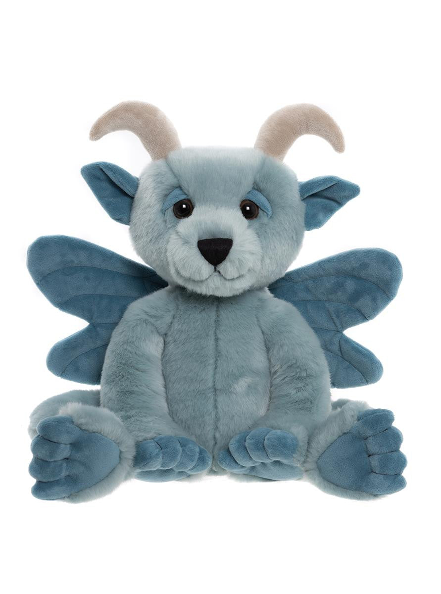 Blue dragon plush toy with wings on a white background